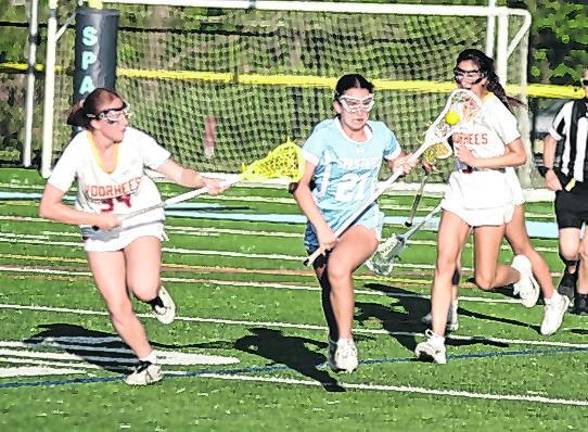 Sparta's Elizabeth Morris is on the move with the ball. Morris scooped up 4 ground balls (GB).