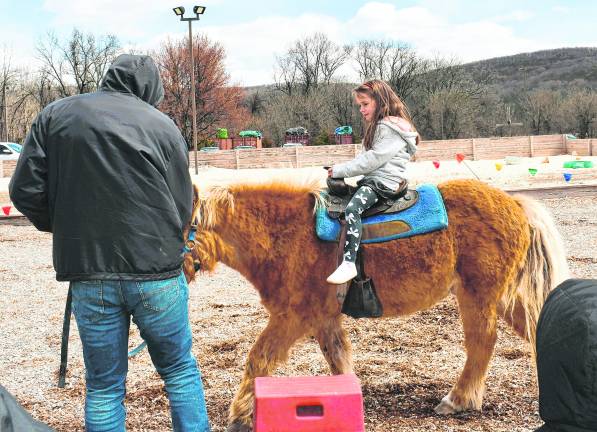 Eden Russel-Krieger of Franklin rides a pony.