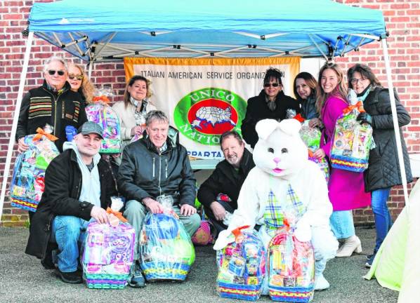 Sparta UNICO members pose with the Easter Bunny.