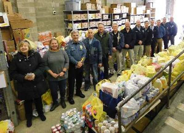 Sussex County Human Services and Social Services personnel, local law enforcement, and other supporters and volunteers were all smiles after unloading the food collected during Stuff the Bus 2018. The county-wide food collection supports the Sussex County Food Pantry. 