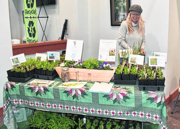 Erin Sholl, the owner of Blue Heron Farm poses for a photo.