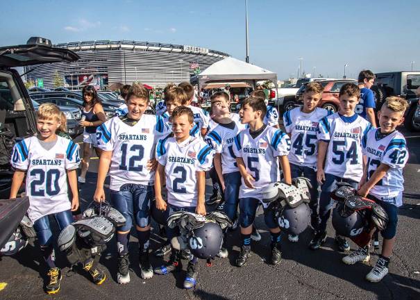 Anxious 5th grade team "patiently" waiting for their game time. From left, #20 Eric McCall #12 Antonios Dimogerodakis #2 Anthony Settembre #5 Sebastian Chiong #45 Trevor Ekeland #54 Brady Shagawat and 3rd grader #42 Landon Ekland