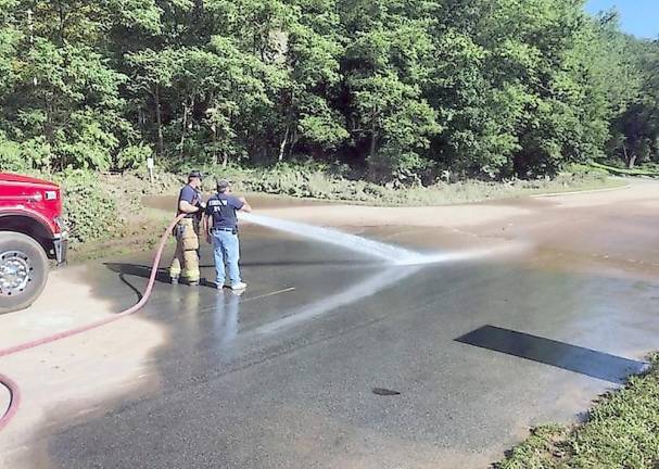 Firefighters from Bushkill Volunteer Fire Company, Station 24, help clean up after Hurricane Ida (NPS Photo/T. Roessner)