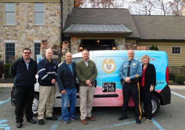 (L-R) Newton Police Chief Mike Richards, Andover Township Police Chief Eric Danielson, Mohawk House owner Steve Scro, Sparta Police Chief Neil Spidaletto, Byram Township Police Chief Pete Zabita, and Stuff the Bus founder Carol Novrit gathered at the Mohawk House on Monday, November 12, 2018 to discuss the details of this year's 10th Annual Stuff the Bus food collection initiative. (Photo by Mandy Coriston).