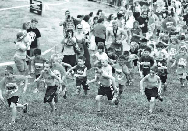 A wave of little competitors took off at the start of the Kids Spartan Race.