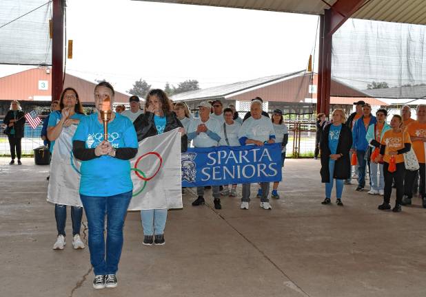 <b>Senior Olympics teams take part in the opening ceremony.</b>