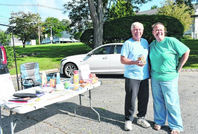 Charlie Collver drops off food with Dawn Costello.