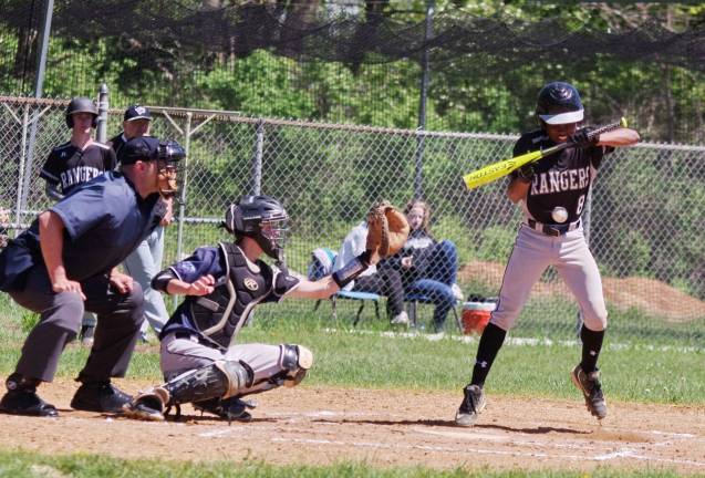 To keep from getting hit Wallkill Valley batter Elijah Bascomb jumps out of the way of the incoming ball in the second inning.