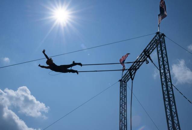 Acrobat Lyric Wallenda of Circus Incredible performs a trapeze act during the fair. (Photo by John Hester)