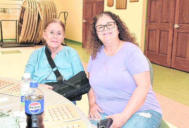 Kate Smith of Mine Hill and Dee Talty of Sparta sit with their bingo cards.
