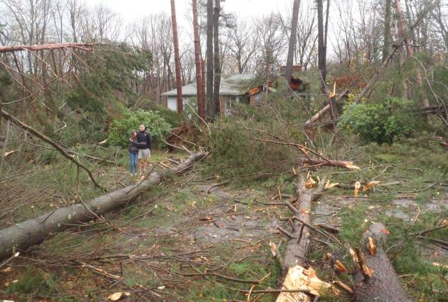 Jennifer and Stephen Piniaha outside their home on Brookside Drive in Sparta.
