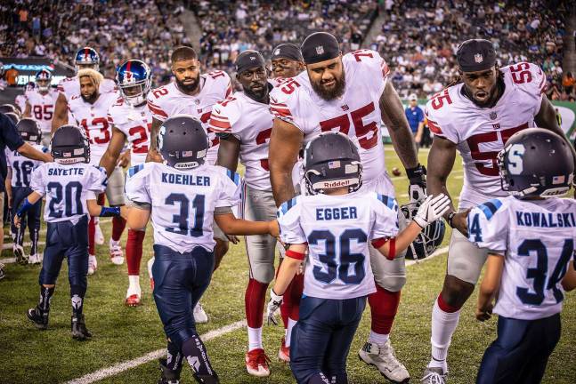 Giants were a class act as the lined up to meet the 3rd graders