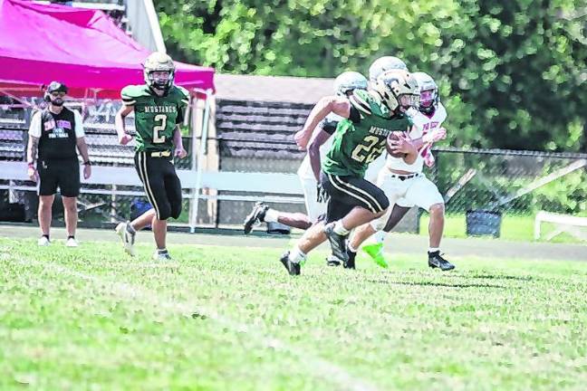 Sussex Tech ball carrier Bret Kellenberger gains yards in the open field.