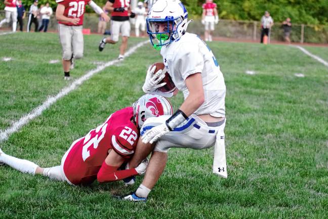 <b>Kittatinny ball carrier Mike Strong is tackled by High Point defender Colton Hornayk in the first half.</b>