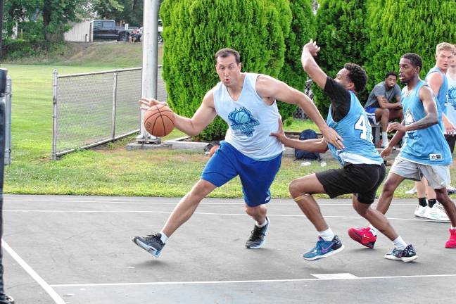 Team Smalley's Almin Hodzic handles the ball on the court.