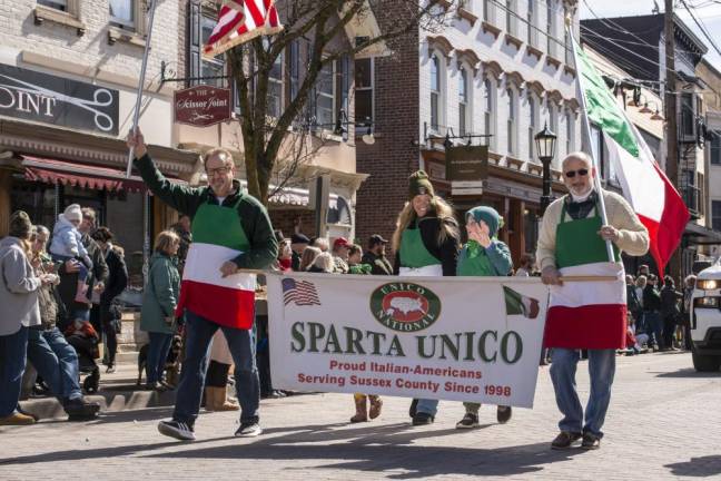 Members of Sparta Unico, an Italian-American heritage organization, march in the parade.