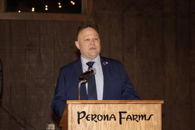 New Capt. Ben Wright speaks at the installation.