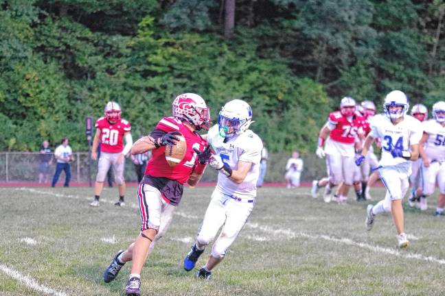 <b>During a failed two-point conversion play by High Point, ball carrier Jerron Martress tries to avoid Kittatinny defender Mike Strong.</b>