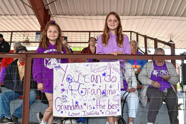 <b>Isabella and Chloe Edwards of Montague cheer on their grandmother. The Montague team won the gold.</b>