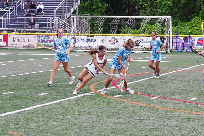 Sparta and Passaic Valley players battle for control of the ball in the first round of the NJSIAA North Jersey, Group 2 tournament May 28. (Photos by George Leroy Hunter)