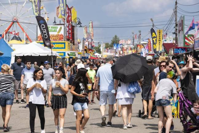 People fill the midway at the New Jersey State Fair on Sunday, Aug. 6. (Photo by John Hester)