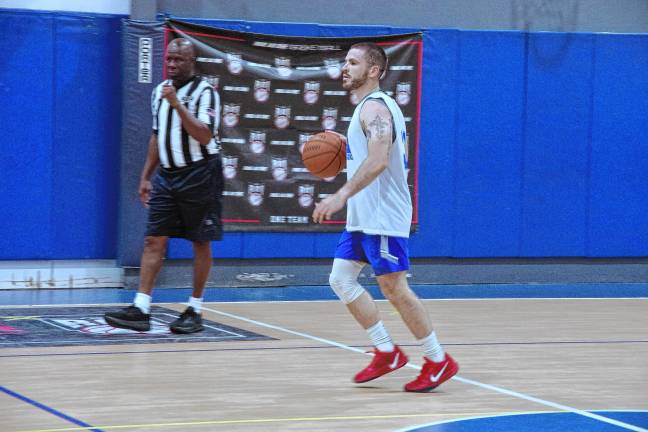 Team Smalley's Nick Miller handles the ball.
