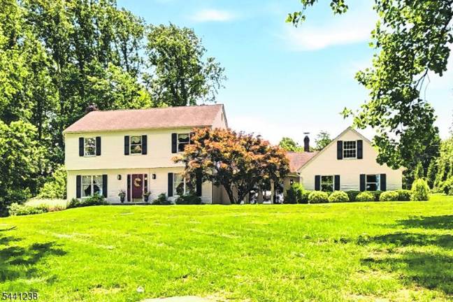 Sparta colonial features classic den, outdoor oasis