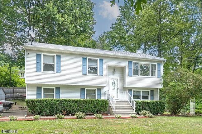 Embrace country life in this lake community home