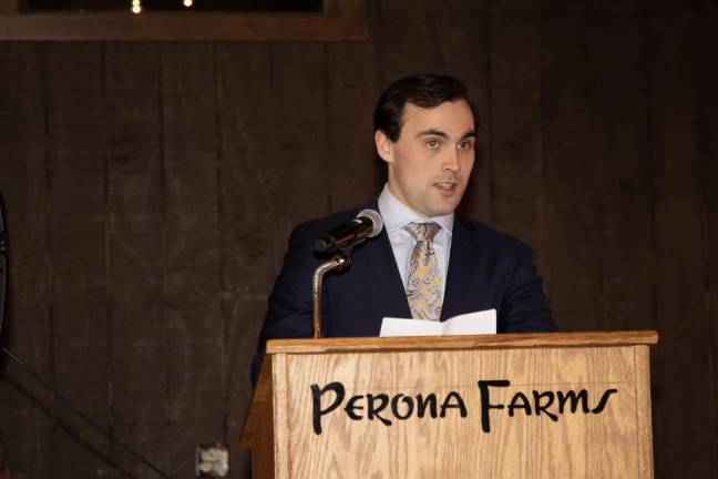 Sparta Ambulance Squad Capt. Max Merlino speaks at the installation.