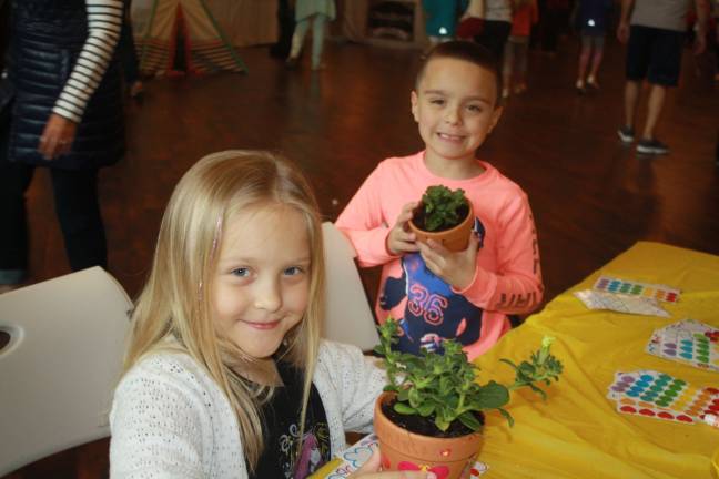 In the spirit of Spring, Madison and Jacob Tarabocchia decorate a plant, sponsored by Lauren Volpe and Dawn Corbo fo Weichert Realtors.