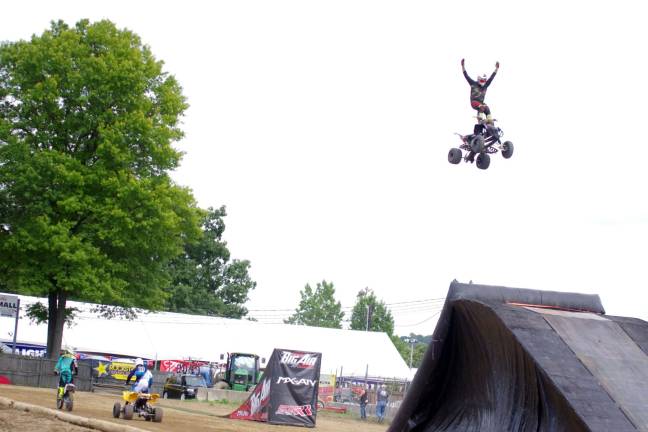 Stuntman Adam Thene makes standing on an all terrain vehicle in midair look easy.