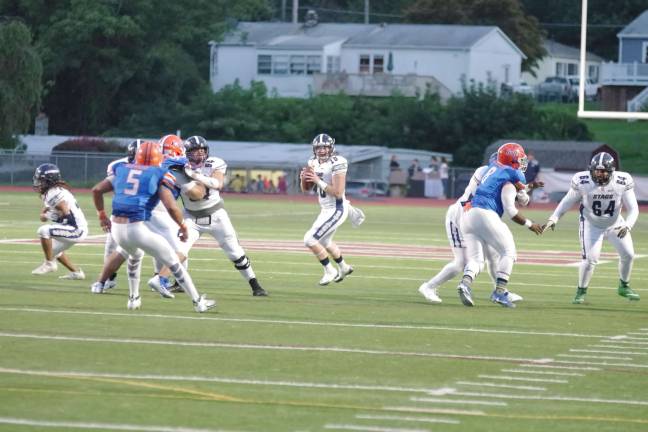 Stags quarterback Jimmy Lahue about to throw.