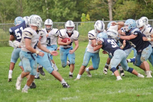 West Morris Central ball carrier Adam Smith moves through an opening in the second half.