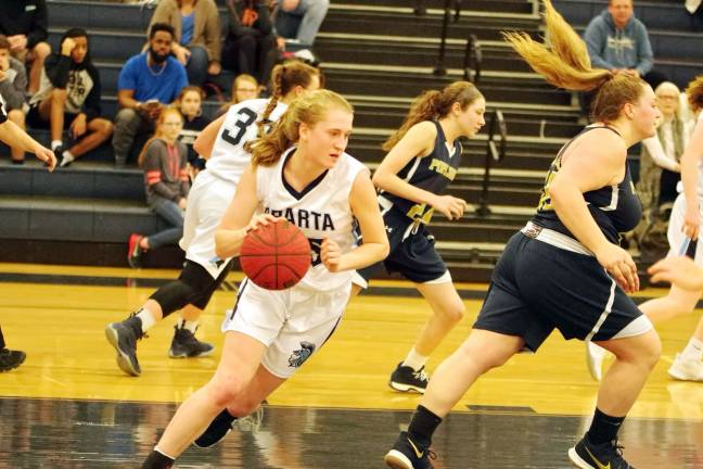 Sparta's Paige Smith handles the ball in the first period. Smith contributed 12 points, four rebounds and three assists.