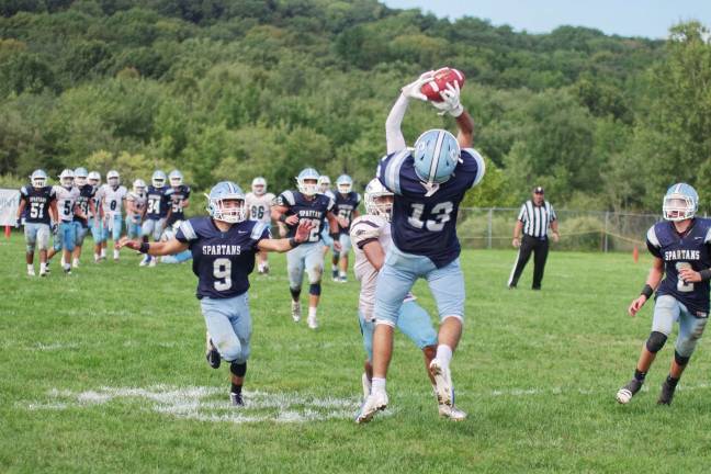 A West Morris Central pass is intercepted by Sparta cornerback Nick Broccoletti late in the fourth quarter.