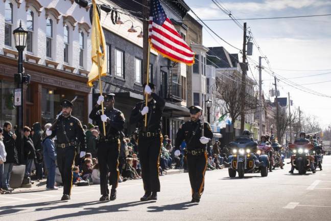 Officers from the Sussex County Sheriff's office march in the parade.