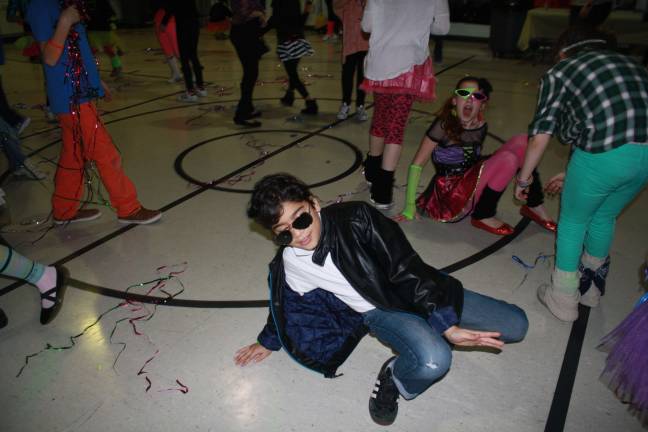 Adrian Figuerereo has all the moves at 80's Night. Photos by Rose Sgarlato