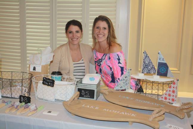 Rustic Paper Studio owners and twins, Brianna Reigstad and Alex Griffin with their hand-crafted items.