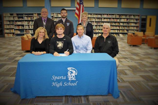 From left, Back row: Steve Stoner, AD; Tyler Meth, head lacrosse coach; Janet Ferraro, Principal Front row: Karen West, mother, Jesse West, and John West, father