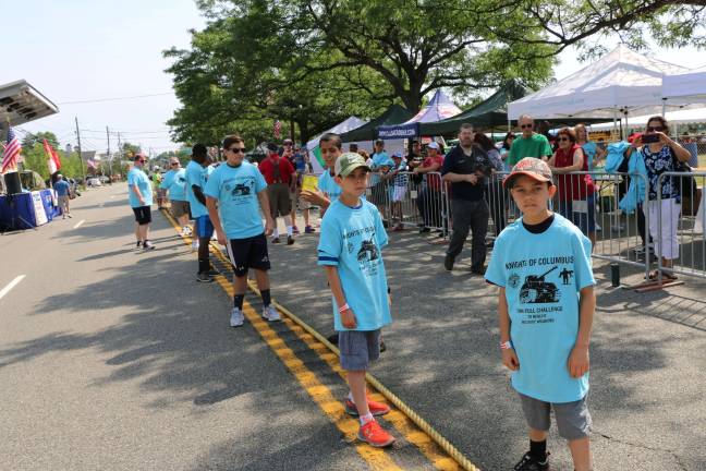 Squires get ready to pull the tank. From back left: Jon Rohe, Ken Joseph, Jack Lubertazzi, Alex Sammarco, Hayden and Maddox Corbin.
