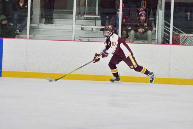 Madison's Ryan Catlin steers the puck. Catlin made one assist.