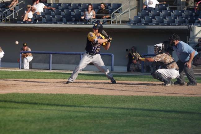 Quebec Capitales James McOwen at the plate. Photos by George Leroy Hunter
