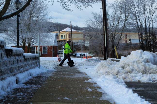 Municipal worker shoveling in Sparta. (Photo by Shannon Kuratli).