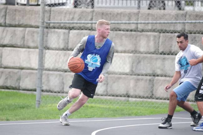 Team Synol's Mike DeLorenzo handles the ball.
