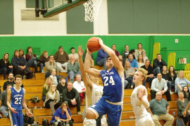Kittatinny's Justin Modafferi takes the ball to the hoop in the third period.