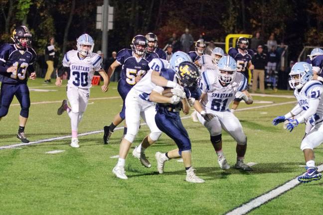 Sparta defender Tucker Hastings grabs Jefferson ball carrier Matthew Cappello in the third quarter. Cappello scored one rushing touchdown.