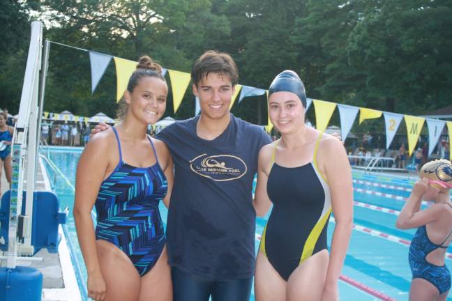 High school seniors and soon to be college freshmen, from left, Bridget Hilgendorff, Ryan Ryersen and Lizzie Wolfe enjoy their last home meet as Hawks swimming for Lake Mohawk Pool. Not pictured, Samantha Russo. Photo by Rose Sgarlato