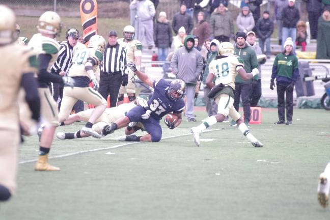 Pope John ball carrier Terrance Jones is tackled in the fourth quarter.