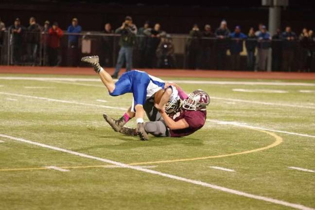 Newton defensive tackle James Harding takes down Kittatinny ball carrier Austin Seames in the first half. Harding accomplished five tackles and one sack.
