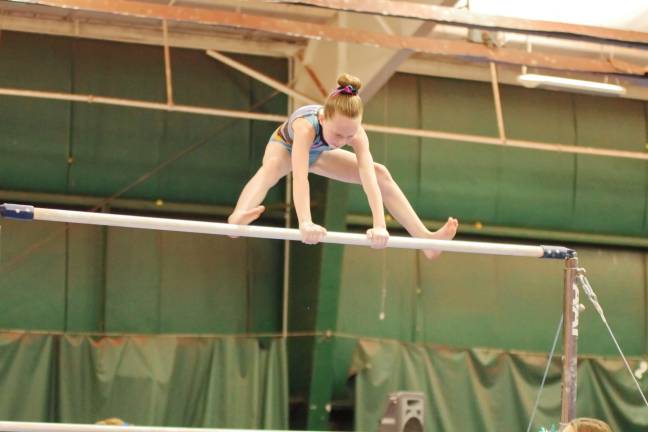 Gymnast Moya Lynch of Wantage, New Jersey performs on the uneven bars. Lynch took first place in the Bronze 8-9 division with an all around score of 34.50. She trains at Westys Gymnastics.